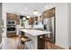 Modern kitchen featuring stainless steel appliances, stylish cabinets, and a large island with seating at 2539 Astaire Ct, Atlanta, GA 30318
