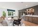 Modern living room featuring a bar with wine rack, marble table, stylish decor, and natural light at 2539 Astaire Ct, Atlanta, GA 30318