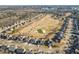 Aerial view of the community featuring a golf course surrounded by residential homes at 3313 Alhambra Cir, Hampton, GA 30228