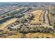 Expansive aerial view of a meticulously planned golf course community featuring well-manicured lawns and green fairways at 3313 Alhambra Cir, Hampton, GA 30228
