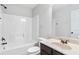 Bathroom featuring tub/shower combo, toilet, sink and vanity with dark cabinets at 3313 Alhambra Cir, Hampton, GA 30228