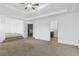 A large main bedroom with access to bathroom, stairs, and living area at 3313 Alhambra Cir, Hampton, GA 30228