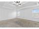 A spacious main bedroom with tray ceiling and large windows at 3313 Alhambra Cir, Hampton, GA 30228