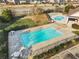 Community pool area featuring a fenced-in pool with an expansive deck area and picnic tables at 3313 Alhambra Cir, Hampton, GA 30228