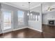 Dining room featuring a chandelier, access to the back deck, and view into the living room at 3313 Alhambra Cir, Hampton, GA 30228