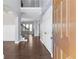 Inviting entryway with dark hardwood floors, fresh gray paint and a grand staircase leading to the upper level at 3313 Alhambra Cir, Hampton, GA 30228