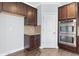 Elegant kitchen featuring stainless steel appliances, granite countertops, and hardwood floors at 3313 Alhambra Cir, Hampton, GA 30228