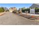 Street view of the deed-restricted community entrance with attractive landscaping and signage at 3313 Alhambra Cir, Hampton, GA 30228