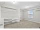 Spacious walk-in closet with multiple shelving units and carpeted floor at 3313 Alhambra Cir, Hampton, GA 30228
