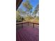 Red wooden deck overlooks the expansive backyard at 4218 Hideaway Dr, Tucker, GA 30084