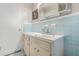 Bathroom with vintage turquoise tile walls, a white sink, and matching flooring at 4218 Hideaway Dr, Tucker, GA 30084