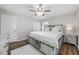 Bright main bedroom featuring a ceiling fan, light gray walls, and coordinating furnishings at 4218 Hideaway Dr, Tucker, GA 30084
