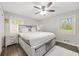 Serene main bedroom featuring natural light, a ceiling fan, and soft carpeting at 4218 Hideaway Dr, Tucker, GA 30084