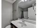 Bathroom featuring a white sink, silver faucet, and a framed mirror at 5264 Mill Way, Stone Mountain, GA 30083