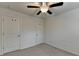 Bedroom with a ceiling fan and natural light provides a versatile and bright space at 5264 Mill Way, Stone Mountain, GA 30083
