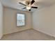 Bedroom with a ceiling fan and ample natural light provides a comfortable and inviting space at 5264 Mill Way, Stone Mountain, GA 30083