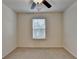 Bedroom with a ceiling fan and natural light provides a versatile and inviting space at 5264 Mill Way, Stone Mountain, GA 30083