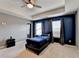 Neutral bedroom with a ceiling fan, plush carpet, and ample natural light provides a comfortable space at 5264 Mill Way, Stone Mountain, GA 30083