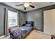 Inviting bedroom features neutral carpet, ceiling fan, and a charming dreamcatcher at 5264 Mill Way, Stone Mountain, GA 30083
