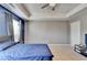 Bedroom with plush carpet, a tray ceiling, and natural light creates a comfortable living space at 5264 Mill Way, Stone Mountain, GA 30083