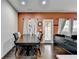 Dining room features hardwood floors, large windows, and an elegant dining table at 5264 Mill Way, Stone Mountain, GA 30083