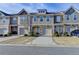 Charming townhomes showcase varied facades, complemented by well-kept landscaping and private driveways at 5264 Mill Way, Stone Mountain, GA 30083