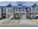 Charming townhomes showcase varied facades, complemented by well-kept landscaping and private driveways at 5264 Mill Way, Stone Mountain, GA 30083