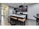Well-lit kitchen showcases a spacious center island with seating and updated stainless appliances at 5264 Mill Way, Stone Mountain, GA 30083