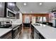 Kitchen featuring stainless steel appliances, white subway tile backsplash, and ample counter space at 5264 Mill Way, Stone Mountain, GA 30083
