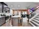 Modern kitchen seamlessly blends into the living room with large island and stainless appliances at 5264 Mill Way, Stone Mountain, GA 30083