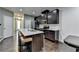 Open kitchen with stainless steel appliances and a center island featuring barstool seating at 5264 Mill Way, Stone Mountain, GA 30083
