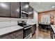 Kitchen featuring stainless steel appliances, white subway tile backsplash, and ample counter space at 5264 Mill Way, Stone Mountain, GA 30083