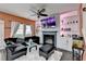 Comfortable living room features a sleek black sofa, fireplace, and built in shelves at 5264 Mill Way, Stone Mountain, GA 30083