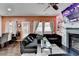 Stylish living area offers a modern black sofa, glass table, and an electric fireplace at 5264 Mill Way, Stone Mountain, GA 30083