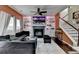 Cozy living room with a fireplace, built-in shelves, plush seating and natural light at 5264 Mill Way, Stone Mountain, GA 30083