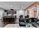 The living room is open to kitchen with bar stool seating and stainless appliances at 5264 Mill Way, Stone Mountain, GA 30083