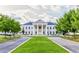 Large stately home with white columns and a beautiful green lawn at 6205 Arnall Nw Ct, Acworth, GA 30101