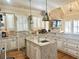 Modern kitchen with granite countertops, a center island, stainless steel appliances, and custom cabinetry at 6205 Arnall Nw Ct, Acworth, GA 30101