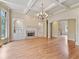 Spacious living room with hardwood floors, fireplace, and coffered ceilings at 6205 Arnall Nw Ct, Acworth, GA 30101