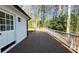 Large deck and exterior white walls of home backing up to wooded area at 152 Weatherstone Pkwy, Marietta, GA 30068