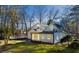 Spacious backyard featuring a lush lawn and white home exterior with large windows at 152 Weatherstone Pkwy, Marietta, GA 30068