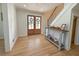 Bright foyer showcasing hardwood floors, a staircase, and a decorative console table at 152 Weatherstone Pkwy, Marietta, GA 30068