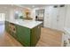 Beautiful kitchen featuring a large center island with stainless steel microwave and green cabinets at 152 Weatherstone Pkwy, Marietta, GA 30068