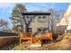 Two-story home featuring a wooden deck, neutral siding, and black-framed windows at 2058 Detroit Nw Ave, Atlanta, GA 30314