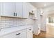 Modern kitchen featuring subway tile backsplash, white cabinets, and stainless steel appliances at 2058 Detroit Nw Ave, Atlanta, GA 30314