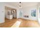 Open-concept living room featuring hardwood floors, recessed lighting, and view of a modern kitchen at 2058 Detroit Nw Ave, Atlanta, GA 30314