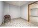 Finished basement area featuring decorative tile flooring and an open doorway at 2436 Green Hollow Ct, Conyers, GA 30012