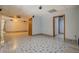Spacious finished basement with decorative tile flooring and multiple rooms at 2436 Green Hollow Ct, Conyers, GA 30012