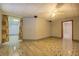 Spacious basement featuring decorative tile flooring with doorways and a ceiling fan at 2436 Green Hollow Ct, Conyers, GA 30012
