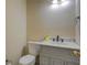 Powder room featuring marble countertop vanity and toilet at 2436 Green Hollow Ct, Conyers, GA 30012